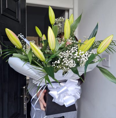 Pure White Lily Gift Box - Pure white lily gift box with elegant oriental lilies and gypsophila, handcrafted by Four Seasons Florist. A timeless choice for sympathy or special occasions.