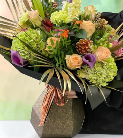 Luxe Allure - A stunning mix of beautiful roses, lush hydrangea and gorgeous gold foliage, finished to create a truly show-stopping bouquet.